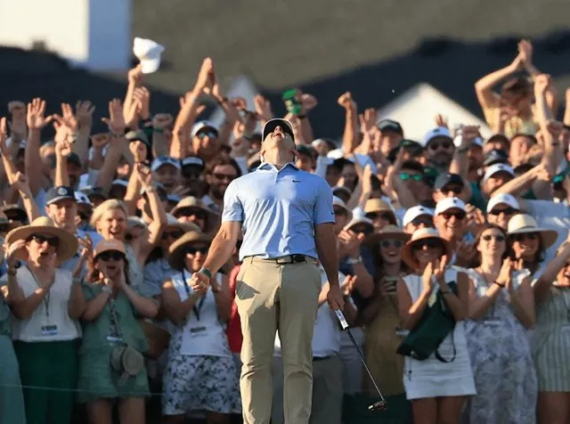 Rory McIlroy celebrates on the 18th green after winning back-to-back Masters titles at Augusta National
