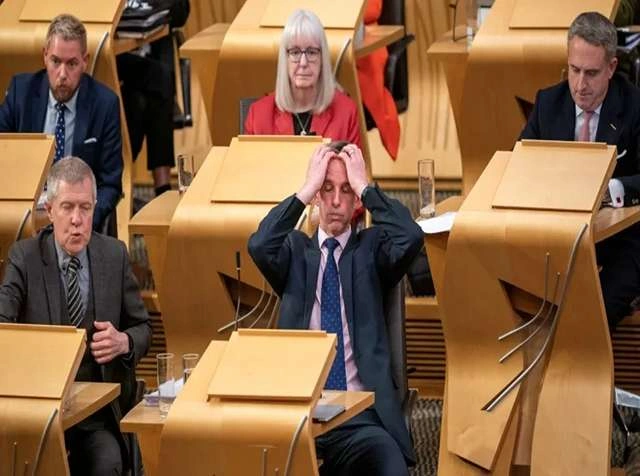 MSPs vote in the Scottish Parliament as assisted dying bill is rejected after debate