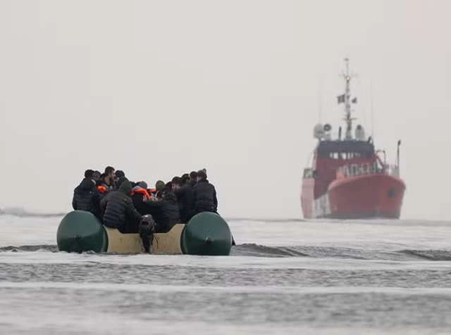 Small boats carrying migrants cross the English Channel as the UK agrees a £660m deal with France to increase enforcement and reduce crossings.